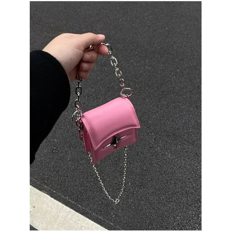 Handbag on a chain with a cross - pink